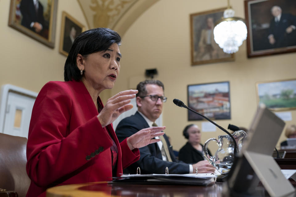 Rep. Judy Chu, D-Calif., left, and Rep. Adrian Smith, R-Neb., right, members of the House Ways and Means Committee, testify as the House Rules Committee prepares the Presidential Tax Filing and Audit Transparency Act of 2022 for a floor vote, at the Capitol in Washington, Wednesday, Dec. 21, 2022. The action is considered an emergency measure and comes in the wake of the yearslong effort to obtain President Donald Trump's tax returns. (AP Photo/J. Scott Applewhite)