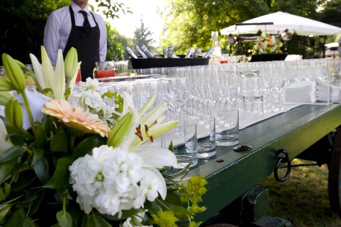 caterers set up with a ton of glassware