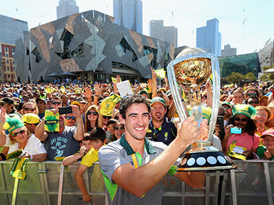 Man of the World Cup Mitchell Starc with the trophy.