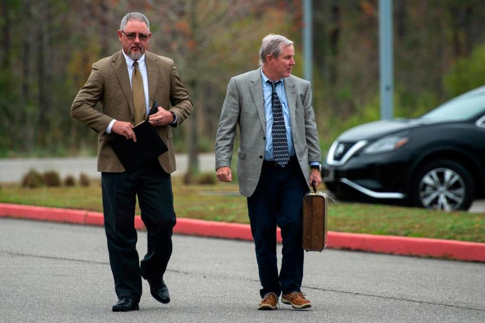 Colin Freeman’s attorney William Covington, left, walks into court at the Hancock County Public Safety Complex in Bay St. Louis on Tuesday, Dec. 7, 2021.