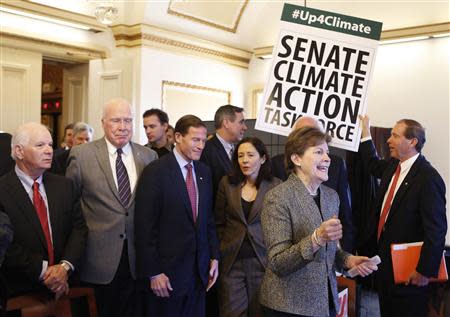 U.S. Senators from the Senate Climate Action Task Force gather before holding the Senate floor to urge action on climate change, on Capitol Hill in Washington March 10, 2014. REUTERS/Yuri Gripas