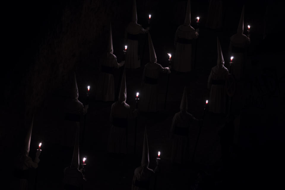 Penitents of the Jesus Yacente brotherhood take part in a Holy Week procession in Zamora, northern Spain Friday, April 18, 2014. Hundreds of processions take place throughout Spain during the Easter Holy Week. (AP Photo/Andres Kudacki)