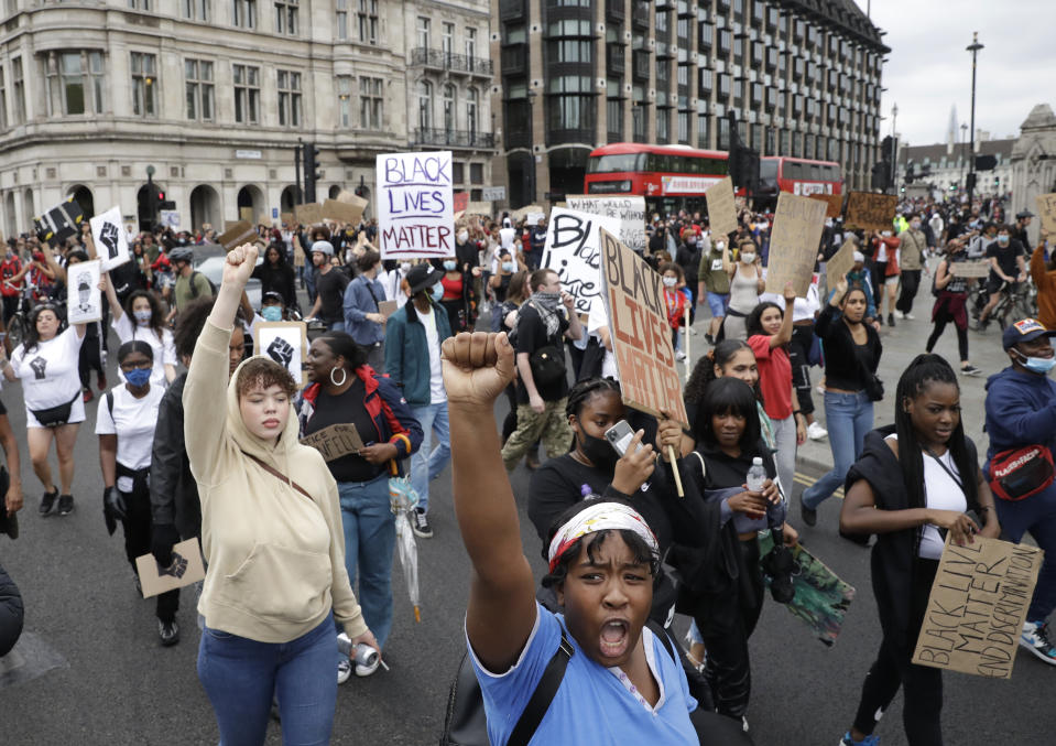 Protesters shout out during a demonstration in Parliament Square in London on Wednesday, June 3, 2020, over the death of George Floyd, a black man who died after being restrained by Minneapolis police officers on May 25. Protests have taken place across America and internationally, after a white Minneapolis police officer pressed his knee against Floyd's neck while the handcuffed black man called out that he couldn't breathe. The officer, Derek Chauvin, has been fired and charged with murder. (AP Photo/Matt Dunham)