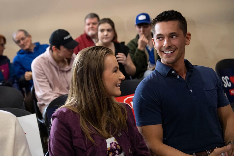 Hannah and Collin Huskey, both 24, of Spartanburg, wait for Nikki Haley to arrive during a campaign rally at the Cannon Centre in Greer, S.C., on Monday, Feb. 19, 2024.