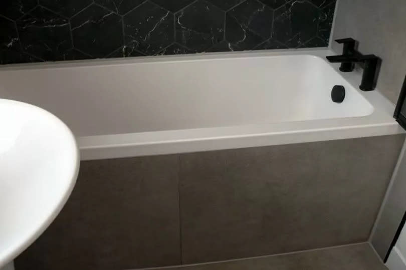 A new bath, basin and toilet plus tiling and flooring