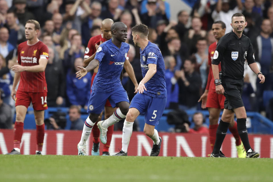 Chelsea's N'Golo Kante, center, celebrates after scoring his side's opening goal during the British premier League soccer match between Chelsea and Liverpool, at the Stamford Bridge Stadium, London, Sunday, Sept. 22, 2019. (AP Photo/Matt Dunham)