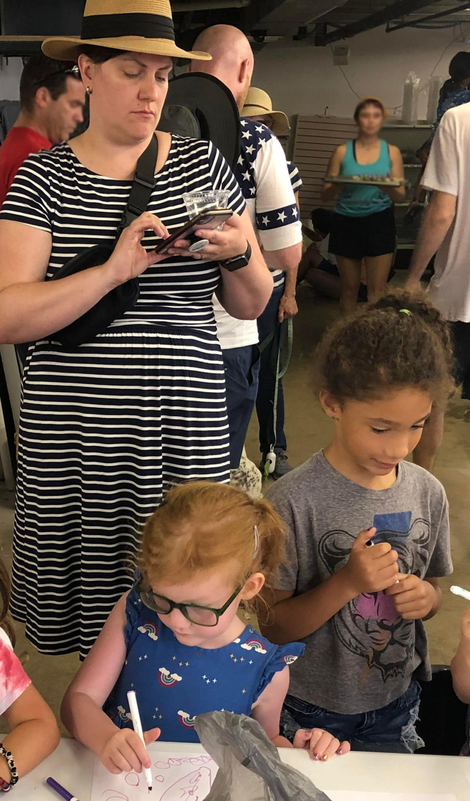 Amy Keifer, with her 4-year-old and her best friend's child, sheltering in place in the basement of a local restaurant after a 21-year-old gunman killed seven people and injured more than 30 more. (Courtesy Amy Kiefer)