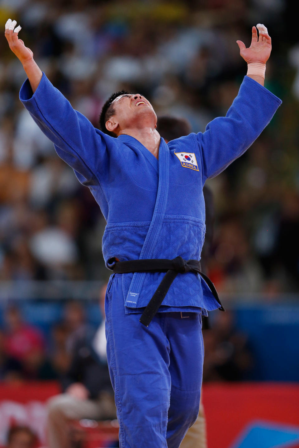 LONDON, ENGLAND - AUGUST 01: Dae-Nam Song of Korea celebrates winning the gold medal during the Men's -90 kg Judo on Day 5 of the London 2012 Olympic Games at ExCeL on August 1, 2012 in London, England. (Photo by Jamie Squire/Getty Images)