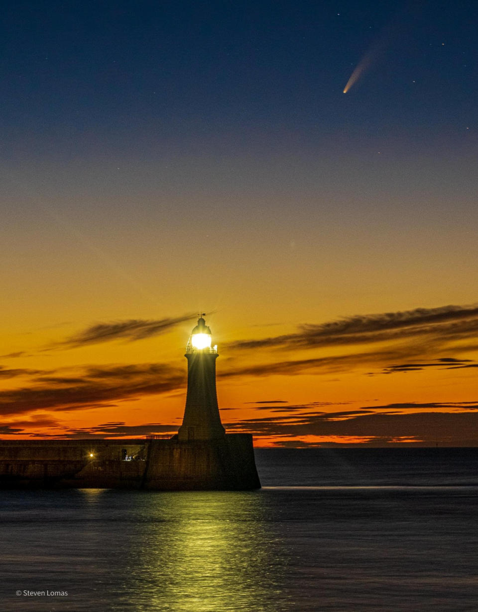 Comet Neowise passes over Roker Light House in Sunderland on 12 July 2020. See SWNS story SWBRcomet.  