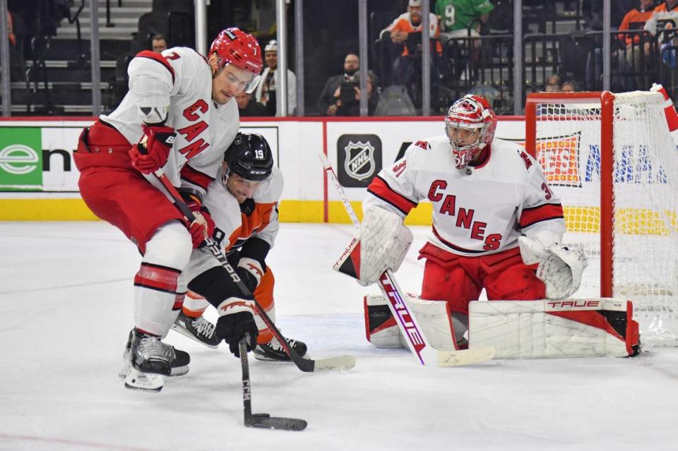 Oct 30, 2023; Philadelphia, Pennsylvania, USA; Philadelphia Flyers right wing Garnet Hathaway (19) and Carolina Hurricanes defenseman Dmitry Orlov (7) battle for the rebound in front of goaltender Frederik Andersen (31) during the third period at Wells Fargo Center. Mandatory Credit: Eric Hartline-USA TODAY Sports