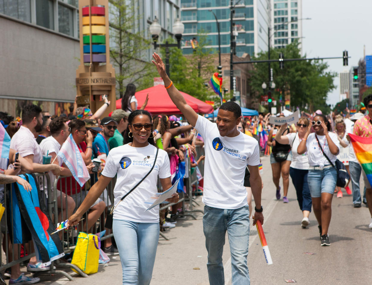 Emmons waves beside his wife, Brittani, at the 2019 Chicago Pride Parade on June 30. (Photo: Eli Jenkinson, Friends to Elect Robert Emmons Jr.)