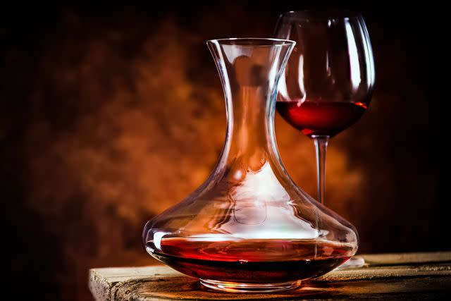 <p>Givaga / Shutterstock</p> Red wine in a decanter