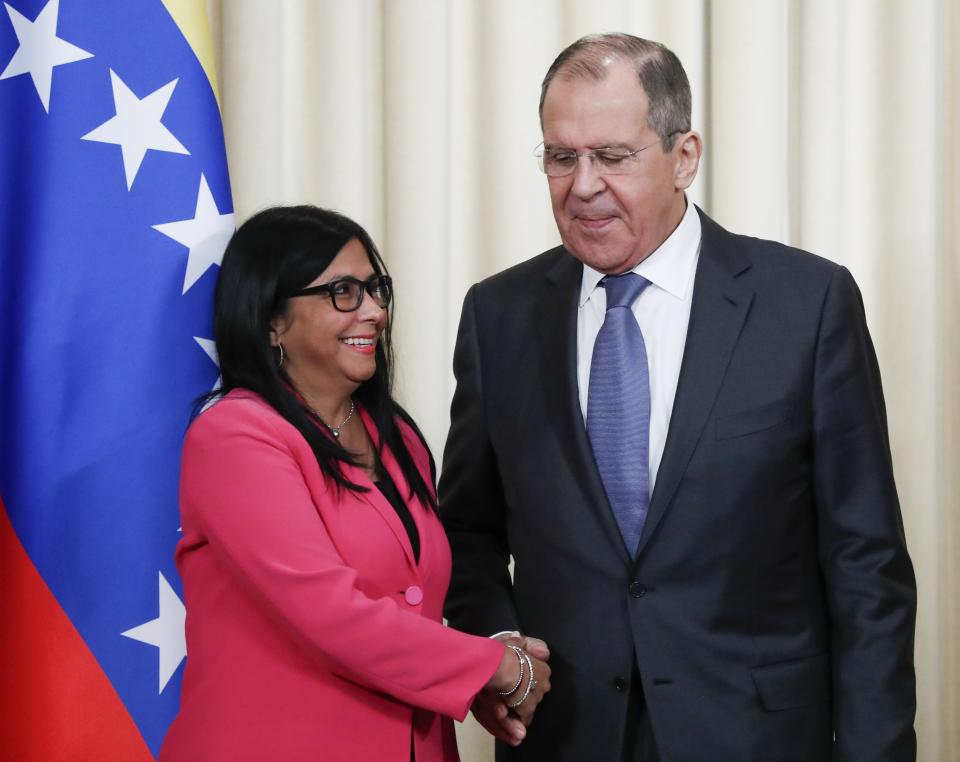 Russian Foreign Minister Sergey Lavrov, right, and Venezuela's Vice President Delcy Rodriguez shake hands after a joint news conference following their talks in Moscow, Russia, Friday, March 1, 2019. Venezuela’s vice president is visiting Russia, voicing hope for stronger ties with Moscow amid the U.S. pressure. (AP Photo/Pavel Golovkin)