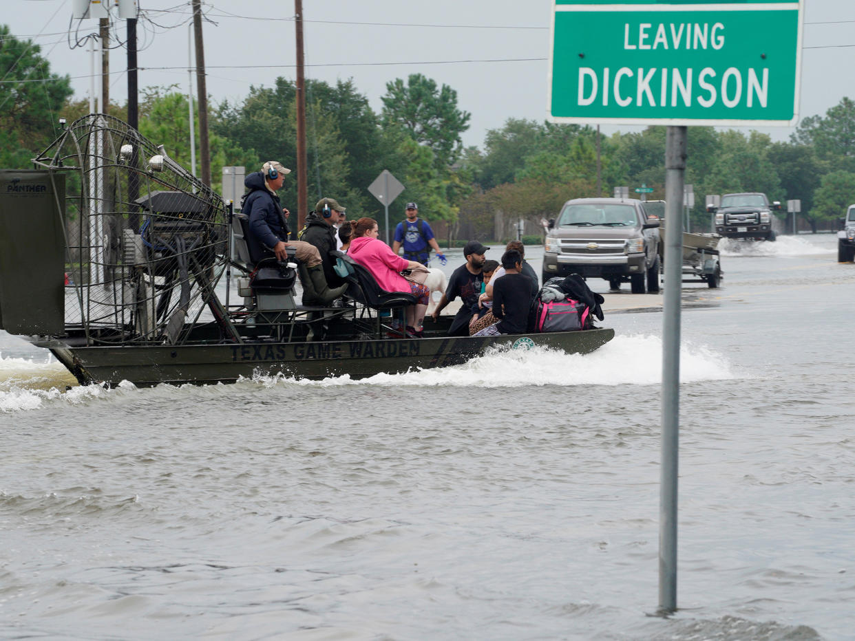 People are rescued by airboat as they evacuate from flood waters after Hurricane Harvey in Dickinson, Texas, in August: Reuters