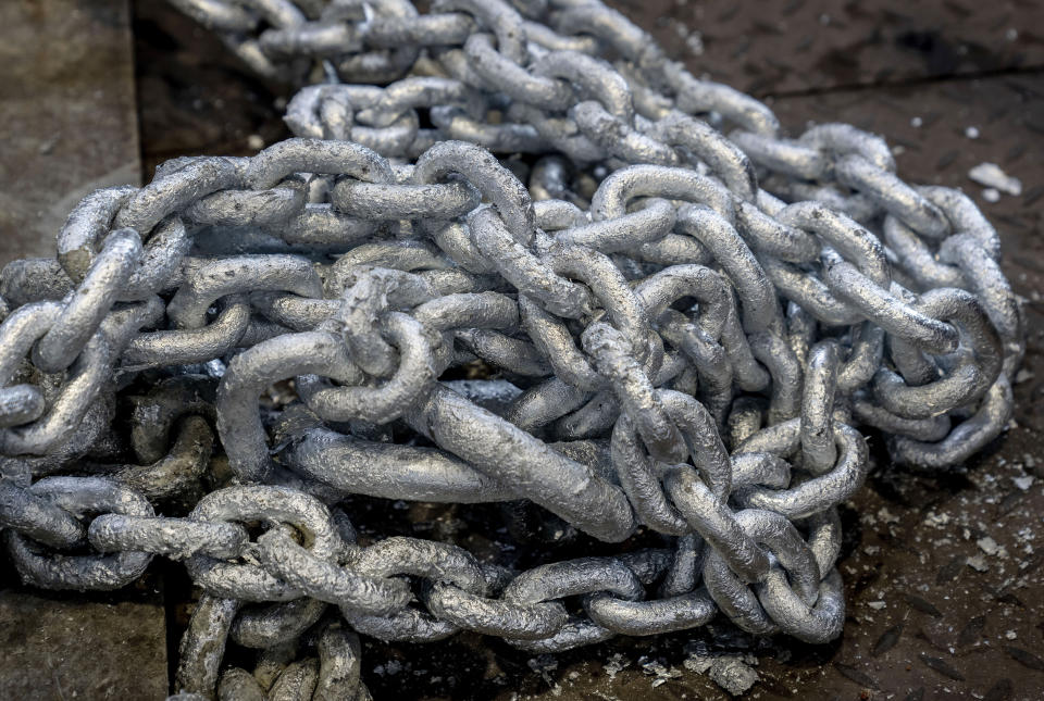 A galvanized chain is pictured in the Zinkpower galvanizing company in Meckenheim, Germany, Thursday, Aug. 18, 2022. In the six months since Russia invaded Ukraine, the fallout from the war has had huge effects on the global economy. Germany may have to impose gas rationing that could cripple industries from steelmaking to pharmaceuticals to commercial laundries. "If they say, we're cutting you off, all my equipment will be destroyed," said Kopf, who's also chair of Germany’s association of zinc galvanizing firms. (AP Photo/Michael Probst)