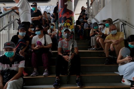 Seniors take part in a 48-hour quiet sit-in protest in front of the police headquarters in Hong Kong