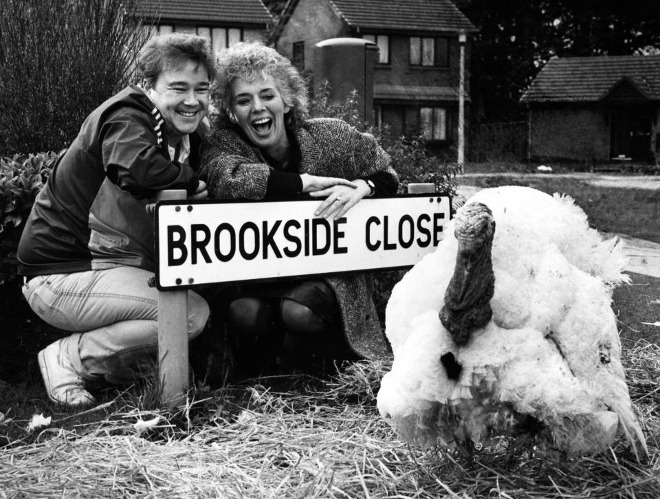 Michael stark and Sue Johnston from the Brookside cast with Trevor the Turkey. 6th November 1985. (Photo by Staff/Mirrorpix/Getty Images)