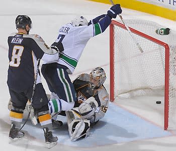 The puck touched Ryan Kesler on its way past Predators goalie Pekka Rinne for the overtime game-winner