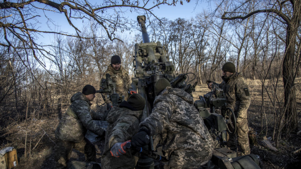  Ukrainian soldiers load a cannon near Bakhmut. 