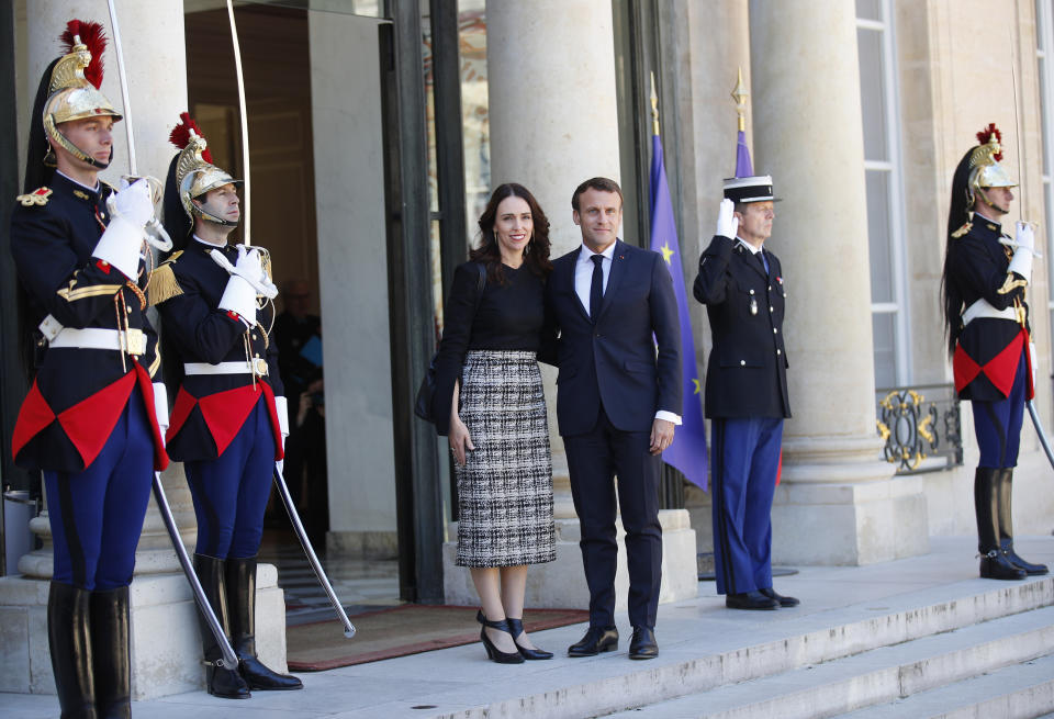 New Zealand Prime Minister Jacinda Ardern, center left, is greeted by French President Emmanuel Macron, center right, as she arrives at the Elysee Palace, in Paris, Wednesday, May 15, 2019. World leaders and tech bosses meet Wednesday in Paris to discuss ways to prevent social media from spreading deadly ideas. (AP Photo/Francois Mori)