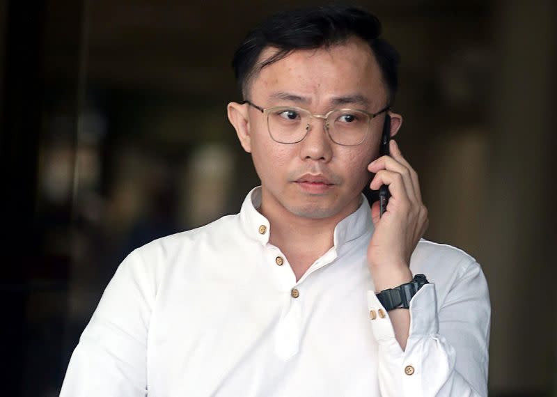 Tan Tong Han, owner of Black Tidings, leaves a court in Singapore