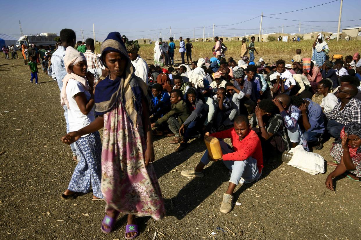 <p>Ethiopian refugees, who fled the fighting in Tigray Region, gather at a border in Gedaref State, eastern Sudan</p> (AFP via Getty Images)