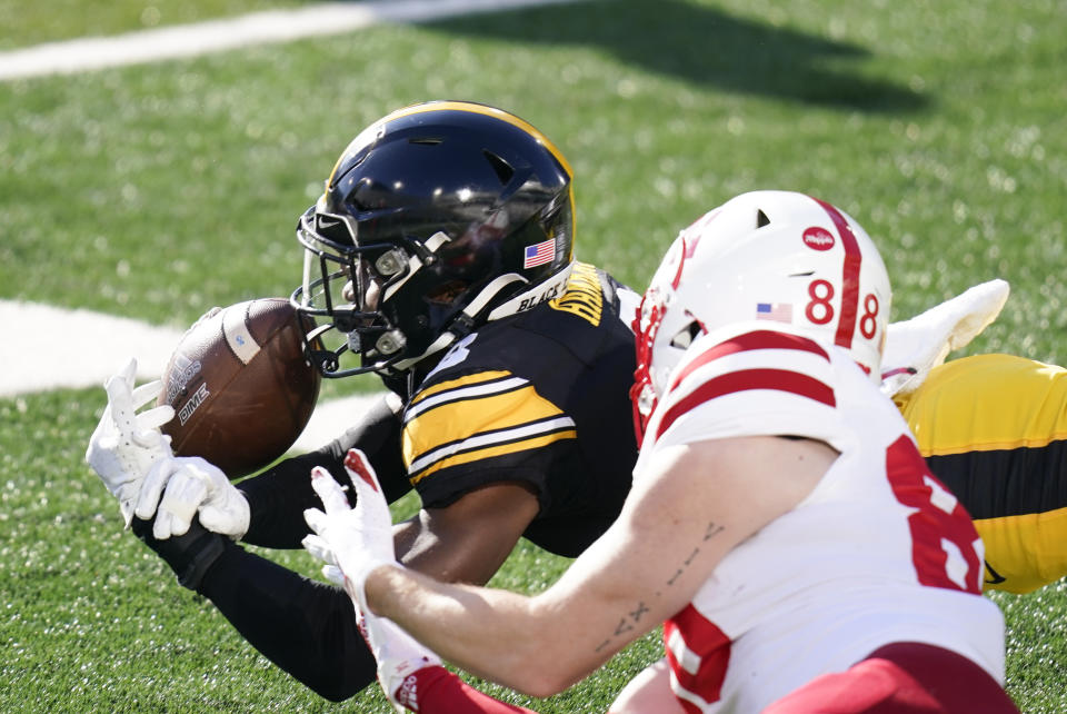 Iowa defensive back Matt Hankins breaks up a pass intended for Nebraska wide receiver Levi Falck (88) during the first half of an NCAA college football game, Friday, Nov. 27, 2020, in Iowa City, Iowa. (AP Photo/Charlie Neibergall)