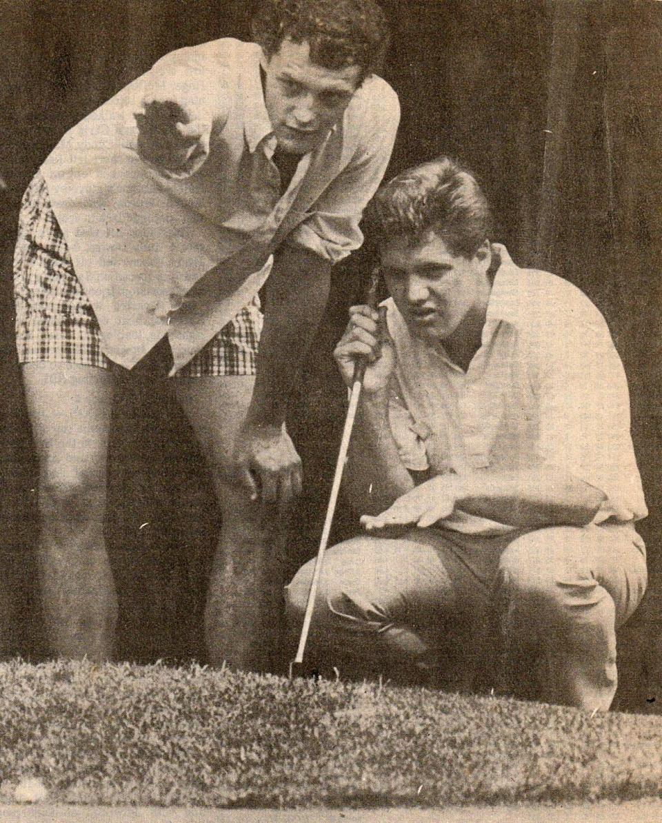 Tim Dunlavey (crouching) assesses a putt with the aid of his brother, Dennis, in this 1980s photo. Tim Dunlavey, a 1986 Cathedral Prep graduate, will be formally enshrined in the Erie District Golf Association's hall of fame during an Oct. 26 ceremony.