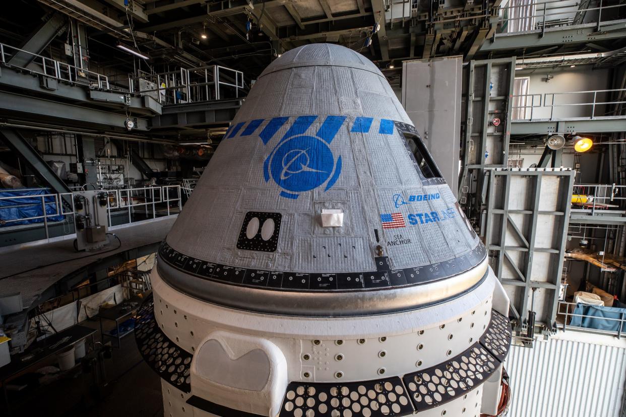 boeing starliner spaceship grey gumdrop capsule with blue markings