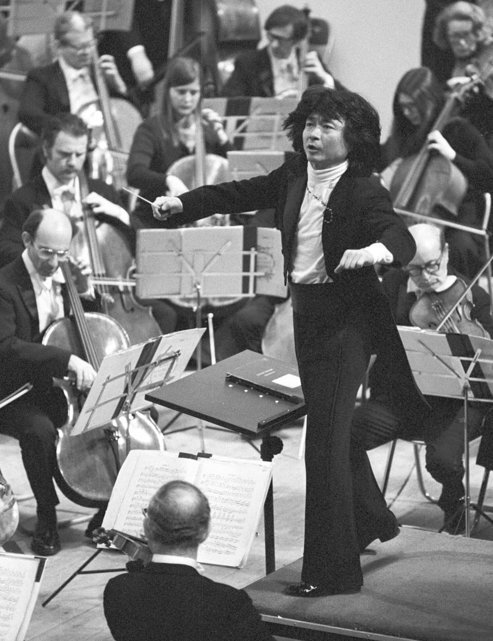 Seiji Ozawa conducts Boston Symphony Orchestra in Fukuoka, western Japan, March 1978. World-renowned conductor Ozawa has died of heart failure at his home in Tokyo, his management office said Friday, Feb. 9, 2024. He was 88. (Kyodo News via AP)