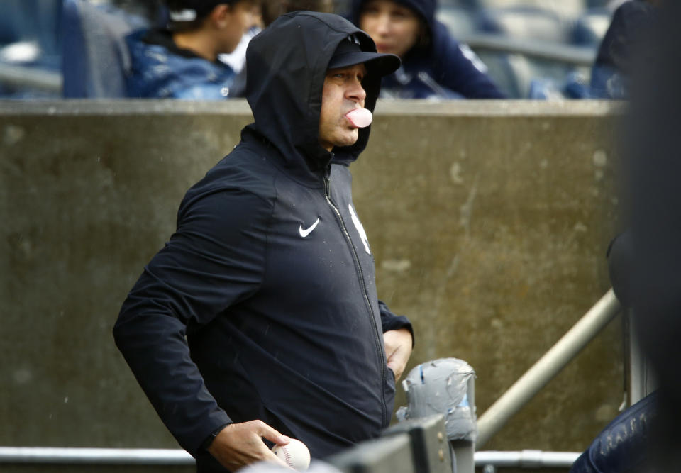 New York Yankees manager Aaron Boone blows a gum bubble in the dugout during a baseball game against the Arizona Diamondbacks, Sept. 24, 2023, in New York. (AP Photo/John Munson)