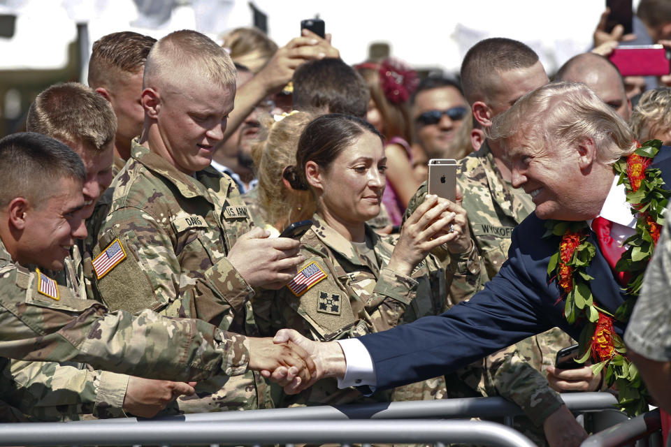 <p>President Donald Trump greets servicemen after arriving aboard Air Force One, Friday, Nov. 3, 2017 at Joint Base Pearl Harbor Hickam in Honolulu. (Jamm Aquino/The Star-Advertiser via AP) </p>