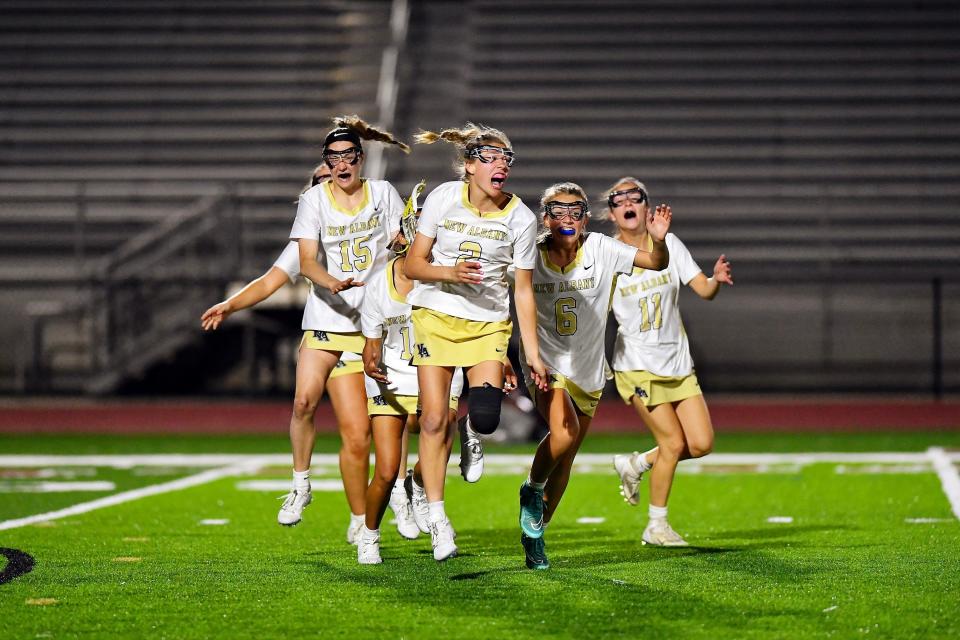 Maddy Paz, center, continues to be one of New Albany's top players in her senior season. Paz, an Ohio State signee, is shown here celebrating after scoring the winning goal in overtime during a 2023 game against Upper Arlington.