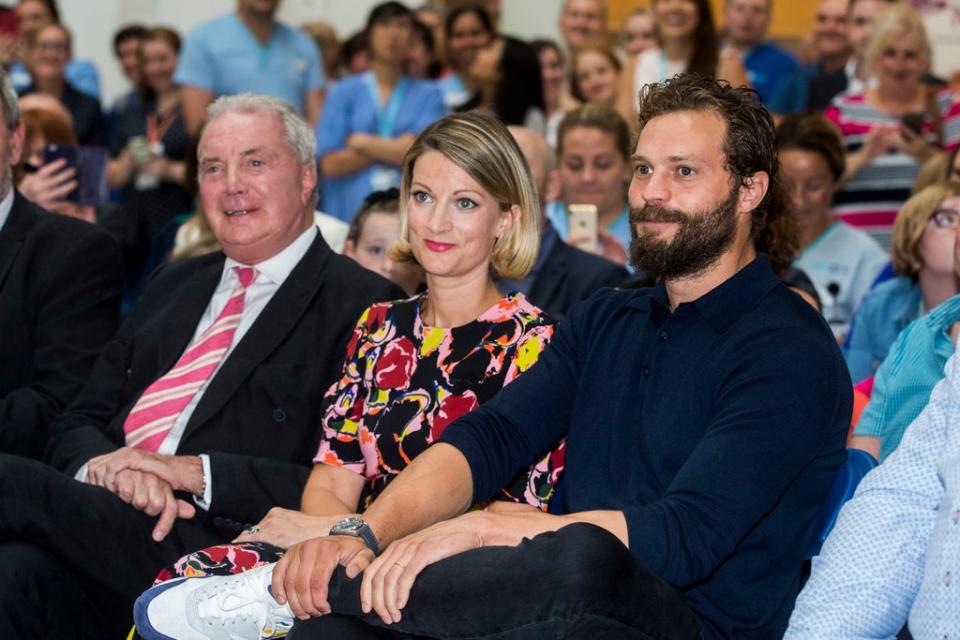 Jamie Dornan (right) with his sister Jessica and father during the Pancreatic Cancer charity NIPanC launch at the Mater Hospital in Belfast (PA Archive)