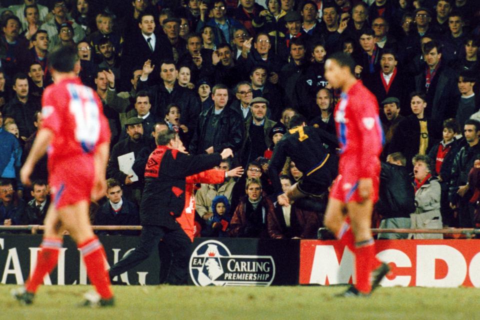 Manchester United's Eric Cantona attacks an abusive Crystal Palace fan having been taunted following his sending off