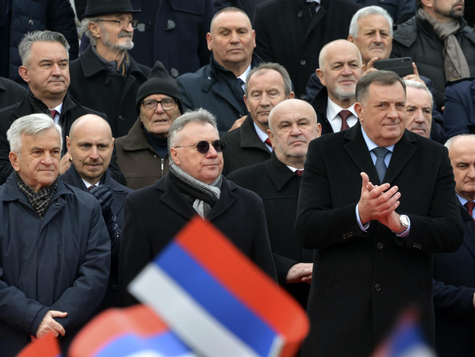 Bosnian Serb political leader Milorad Dodik, front right, applauds during a parade marking the 30th anniversary of the Republic of Srpska in Banja Luka, northern Bosnia, Sunday, Jan. 9, 2022. Dodik was slapped with new U.S. sanctions for alleged corruption. Dodik maintains the West is punishing him for championing the rights of ethnic Serbs in Bosnia — a dysfunctional country of 3.3 million that's never truly recovered from a fratricidal war in the 1990s that became a byname for ethnic cleansing and genocide. (AP Photo/Radivoje Pavicic)