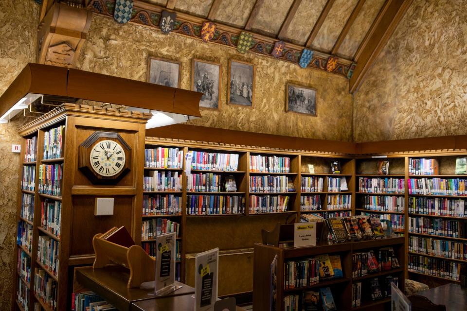 Books and old photographs line the walls in the original library, which was built in 1925, at Wagnalls Memorial in Lithopolis, Ohio on August 22, 2022.