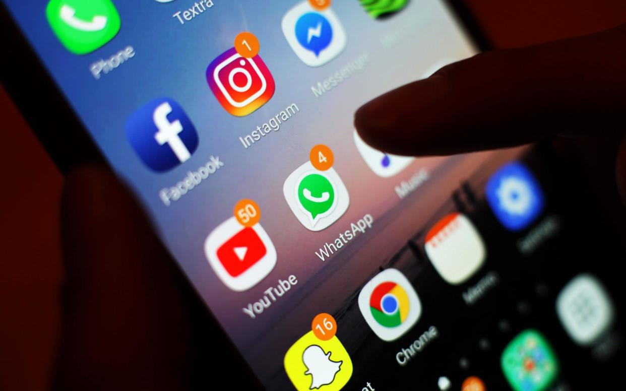 File photo dated 03/01/2018 of social media apps displayed on a mobile phone. Addiction to social media should potentially be classed as a disease, MPs said as they called for tough new regulation to protect children from firms operating in an "online Wild West". PRESS ASSOCIATION Photo. Picture date: Monday March 18, 2019. In a new report looking at the impact of social media on mental health, MPs said platforms such as Facebook, Twitter and Instagram should be regulated by Ofcom and forced to adhere to a statutory code of conduct. See PA story HEALTH Social.  - Yui Mok/PA Wire
