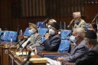 Pushpa Kamal Dahal, leader of the splinter group in the governing Nepal Communist Party attends a meeting of the parliament in Kathmandu, Nepal, Monday, May 10, 2021. Nepal’s prime minister asked parliament for a vote of confidence on Monday in an attempt to show he still has enough support to stay in power despite an expected second split within his governing party. (AP Photo/Niranjan Shrestha)