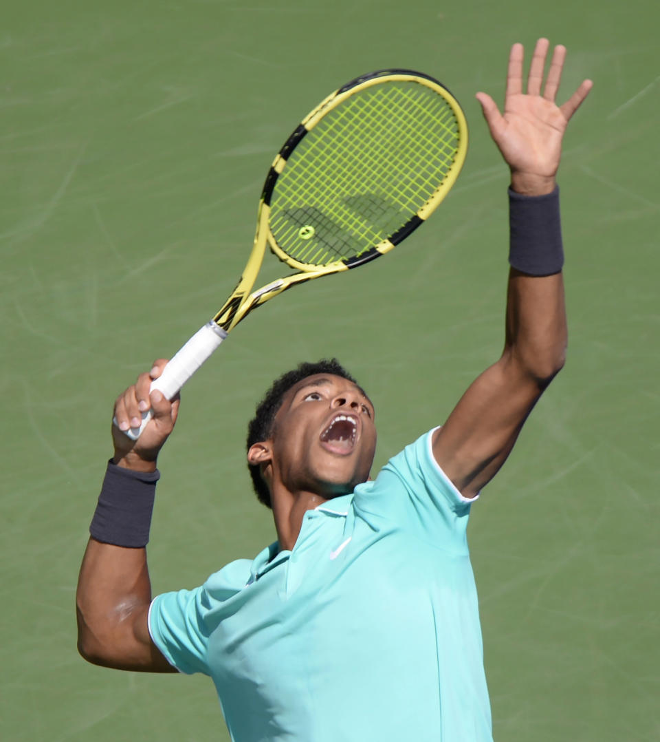 Canada's Felix Auger-Aliassime serves to Russia's Karen Khachanov during the Rogers Cup men’s tennis tournament Thursday, Aug. 8, 2019, in Montreal. (Paul Chiasson/The Canadian Press via AP)