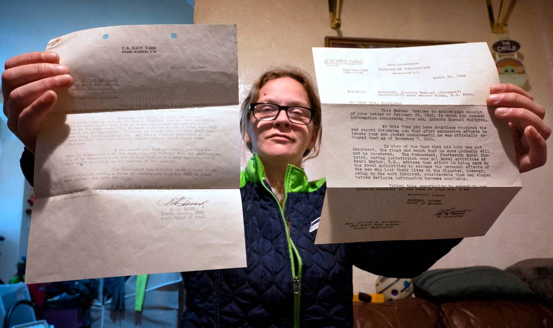 Terry Hughes holds the Department of Navy letters notifying the family of sailor Lorentz Hultgren’s death aboard the USS Oklahoma at Pearl Harbor in 1941. They were found inside a book at a Tacoma used book store and - after a lengthy search - returned to Hughes by The News Tribune reporter Craig Sailor. She is shown at her home in southwest Tacoma, Washington, on Tuesday, Nov. 29, 2022.