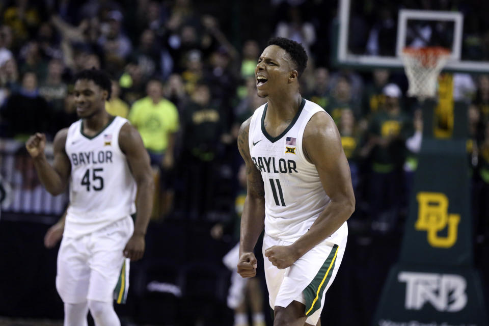 Baylor guard Mark Vital reacts to his blocked shot of Butler late in the second half of an NCAA college basketball game, Tuesday, Dec. 10, 2019, in Waco, Texas. Looking on is Baylor guard Davion Mitchell, left. (AP Photo/Rod Aydelotte)