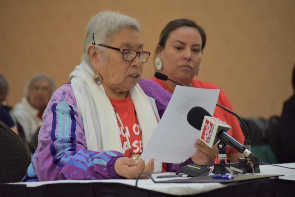 Faith Spotted Eagle, a Dakota elder (left), speaks in opposition to the state's proposed social studies standards while Cante Heart (right) looks on during the Board of Education Standards meeting in Pierre on April 17, 2023.