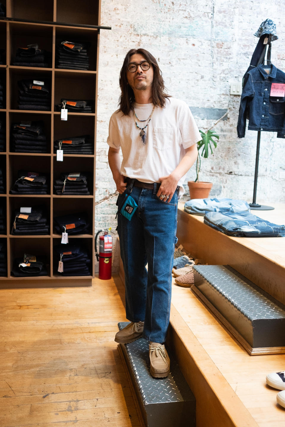 man wearing cool outfit inside of a store in new york