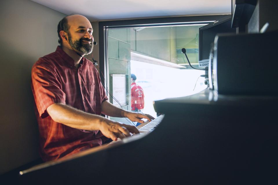 In this April 13, 2017, photo provided by the Boston Red Sox, organist Josh Kantor performs during a baseball game against the Pittsburgh Pirates at Fenway Park in Boston. Each afternoon since what would have been opening day in 2020, Kantor has been live-streaming concerts of ballpark music and other fan requests in an attempt to recreate the community feeling baseball fans might be missing while the sport is shut down during the coronavirus pandemic. (Matthew Thomas/Boston Red Sox via AP)