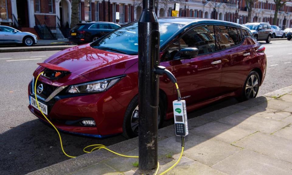 A Nissan Leaf charging on a lamppost in London.