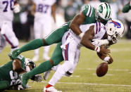 <p>Buffalo Bills quarterback Tyrod Taylor, bottom, fumbles the ball as he is hit by New York Jets outside linebacker Jordan Jenkins (48) during the second half of an NFL football game, Thursday, Nov. 2, 2017, in East Rutherford, N.J. (AP Photo/Kathy Willens) </p>