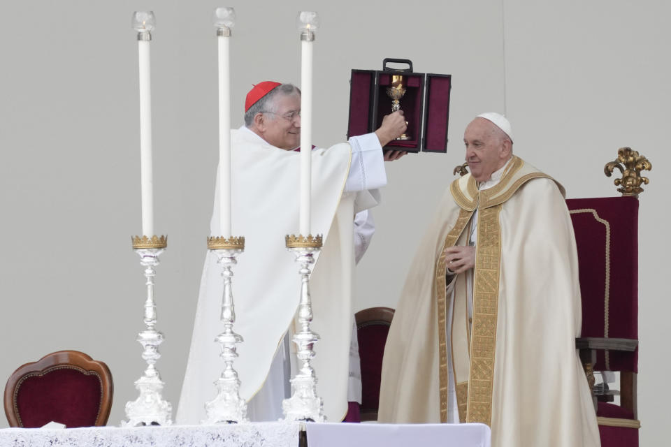 Pope Francis is flanked by Cardinal Francesco Moraglia, left, at the end of a mass in St. Mark's Square, Venice, Italy, Sunday, April 28, 2024. The Pontiff arrived for his first-ever visit to the lagoon town including the Vatican pavilion at the 60th Biennal of Arts. (AP Photo/Antonio Calanni)