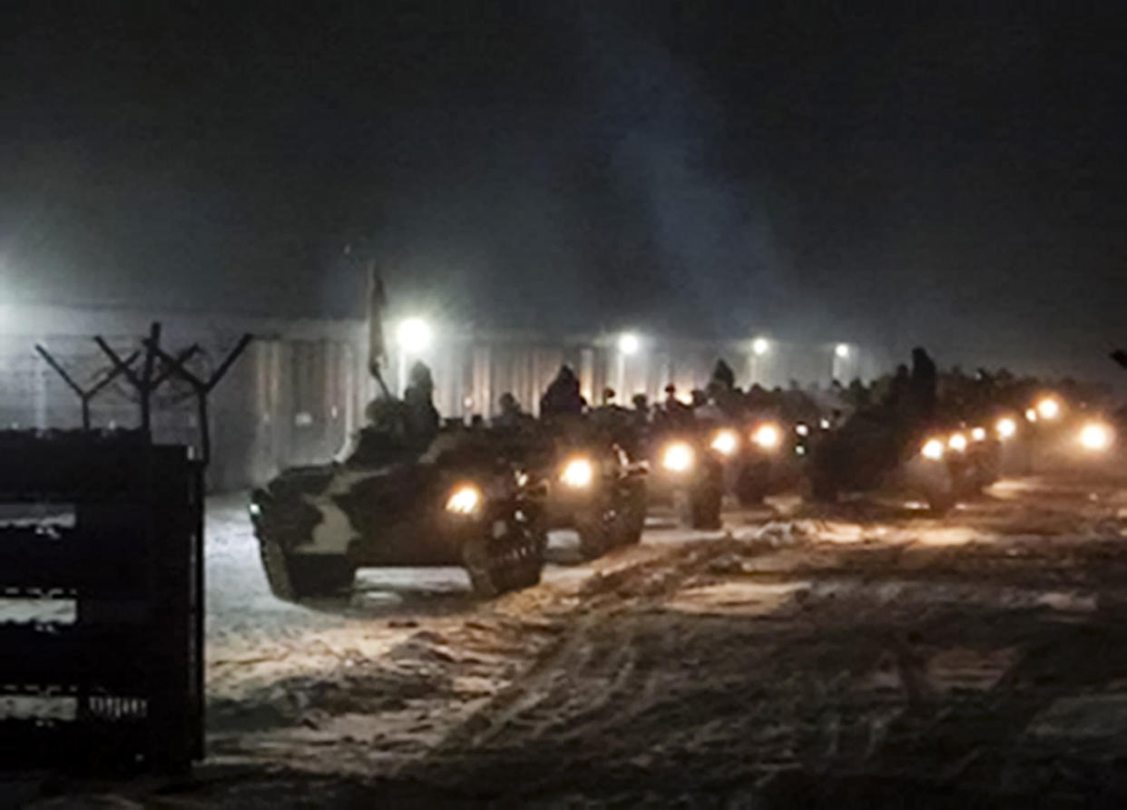 In this photo provided by Vayar Military Agency on Tuesday, Jan. 25, 2022, Belarusian military vehicles gather preparing to attend Belarusian and Russian joint military drills in Belarus. Russia has sent an unspecified number of troops from the country's far east to its ally Belarus, which shares a border with Ukraine, for major war games next month. (Vayar Military Agency Agency via AP)