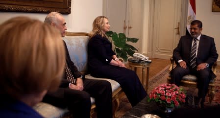 FILE PHOTO: Egypt's President Mursi meets with U.S. Secretary of State Clinton, Egypt's Foreign Minister Kamel Amr and U.S. Ambassador to Egypt Patterson at the presidential palace in Cairo